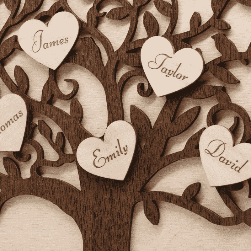 a wooden family tree with engraved hearts