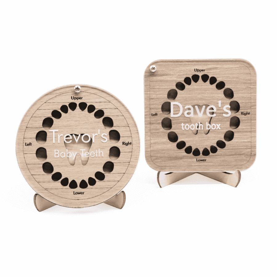 a pair of personalised wooden baby tooth boxes with engraved lids