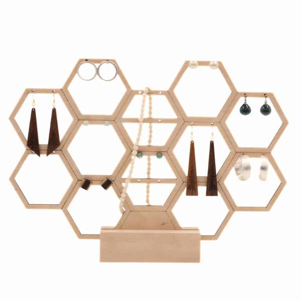 a wooden honeycomb earring holder