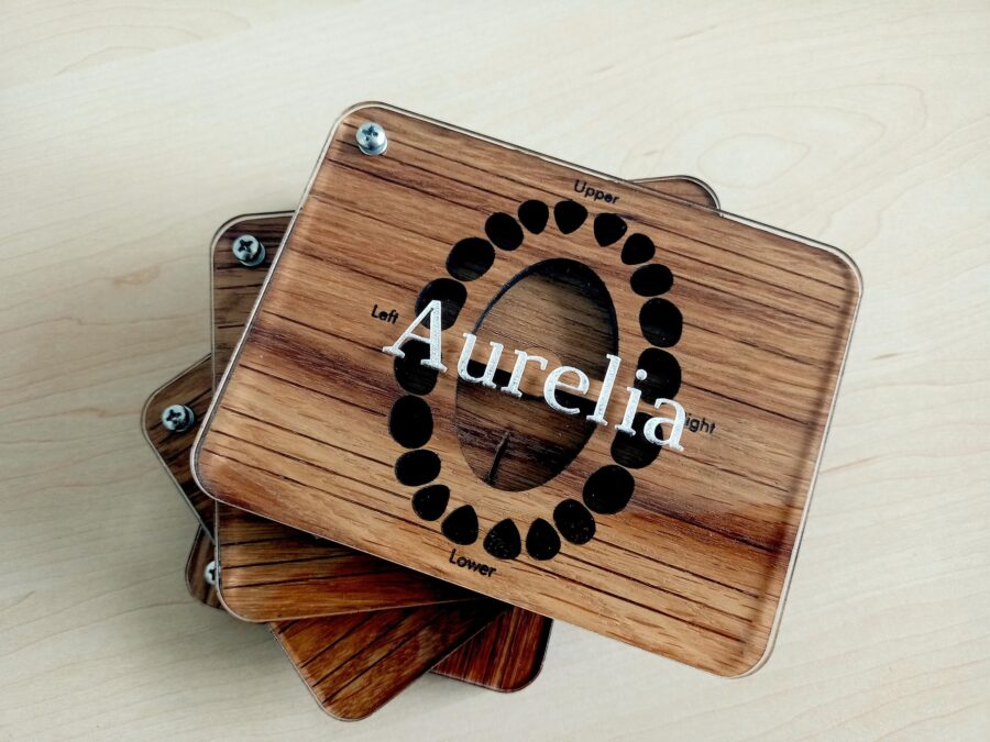 a wooden baby tooth box with a glass lid