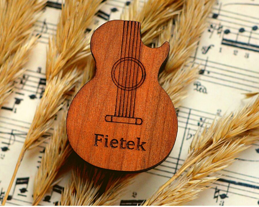 a wooden guitar shaped pick box