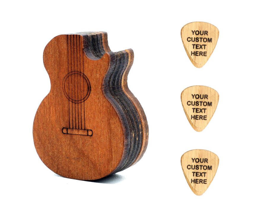 a wooden guitar shaped pick box with engraved picks