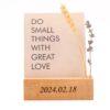 a wooden personalized photo stand
